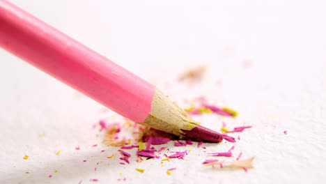 Pink-broken-colored-pencil-on-white-background