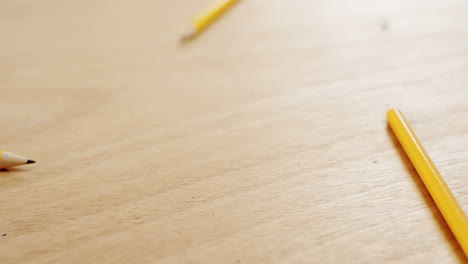 Yellow-colored-pencils-on-wooden-table
