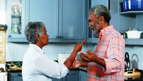 Senior-couple-quarrelling-with-each-other-in-kitchen