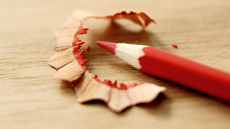Close-up-of-red-color-pencil-with-pencil-shaving