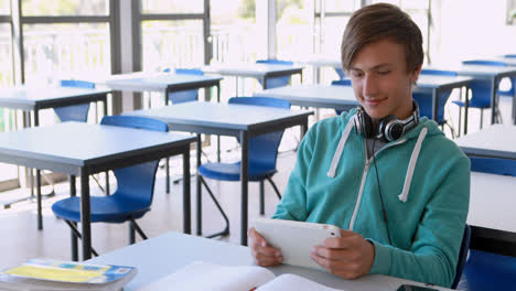 Schoolboy-using-digital-tablet-in-classroom