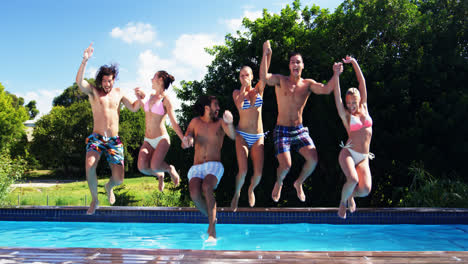 Happy-friends-jumping-into-swimming-pool