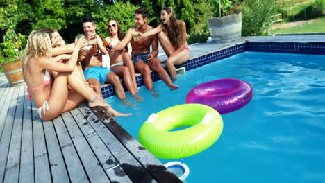 Group-of-friends-having-fun-at-poolside