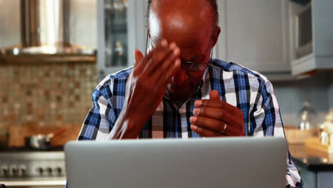 Stressed-senior-man-using-laptop