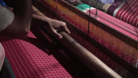 A-weaver-weaves-cloth-in-an-ancient-way