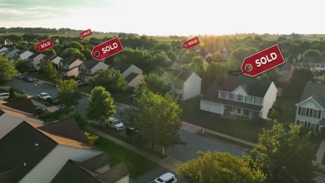Aerial-view-of-a-suburban-neighborhood-at-sunset-with-multiple-"SOLD"-signs-above-houses