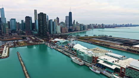 Aerial-view-toward-the-Centennial-Wheel-at-Navy-Pier,-cloudy-evening-in-Chicago