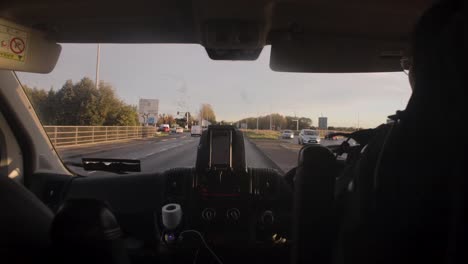 A-timelapse-from-inside-a-motor-vehicle-during-a-morning-commute-through-the-city-of-Dublin,-Ireland