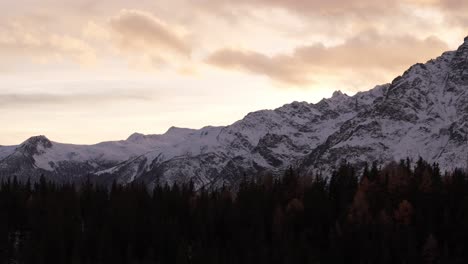 Winter-In-Valmalenco-Of-Valtellina-At-Sunset,-Aerial-Drone-Pan-up