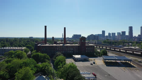Factory-with-chimney-in-suburb-district-of-Atlanta-City-at-sunlight