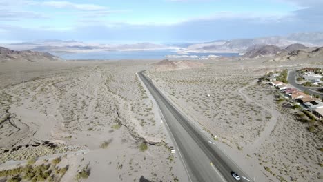 Lake-Mead-wide-shot-and-Highway-93-near-Boulder-City,-Nevada-and-drone-video-moving-down