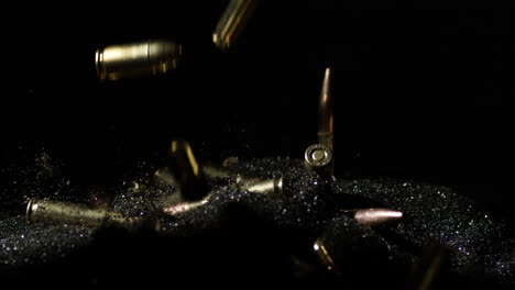 Variety-Of-Gun-Bullets-Dropping-Over-Smokeless-Powder