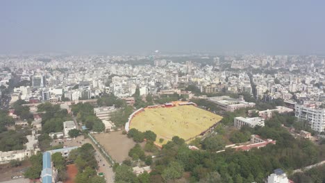 Rajkot-aerial-drone-view-drone-camera-lots-of-people-flying-big-big-kites-in-big-field