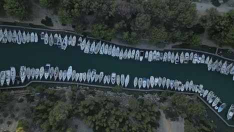 Top-Down-Aerial-View,-Moored-Boats-in-Narrow-Bay,-Calanque-National-Park,-France