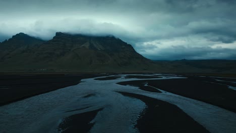 Incredible-drone-aerial-shot-towards-hilly-cliffs-over-several-snaking-rivers