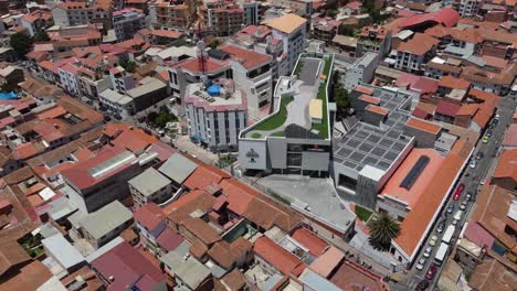 Low-aerial-orbits-creative-building-architecture-in-Sucre,-Bolivia