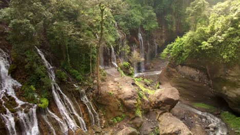 Hidden-gem-Waterfall-with-hundreds-streamline-in-East-Java-Indonesia,-aerial-4k-drone-footage