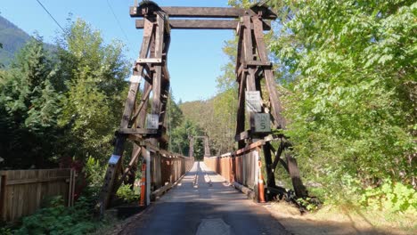 Establishing-shot-approaching-a-wooden-suspension-bridge