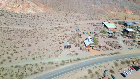 Abandoned-Cars-And-Houses-At-Nelson-Ghost-Town-In-Nevada,-USA---Aerial-Drone-Shot
