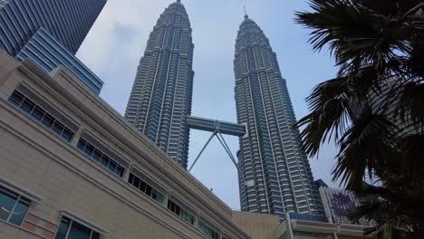Typical-but-different-editorial-view-of-the-Petronas-Twin-Towers,-an-iconic-symbol-of-Malaysia's-booming-economy