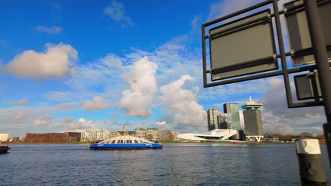 Ferry-arriving-from-NDSM-to-central-station-on-IJ-river-view-on-Overhoeks-Noord