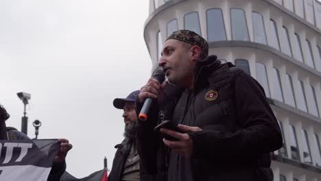 Men-Chant-Passionately-Into-Microphone-at-Palestine-Protest