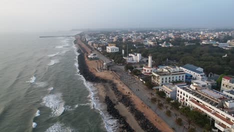 Early-morning-aerial-footage-of-Pondycherry-Beach,-one-of-the-oldest-French-colonies