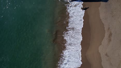 Bedruthan-Steps-Top-Down-Aerial-Shot-of-Beach-and-Ocean-Waves