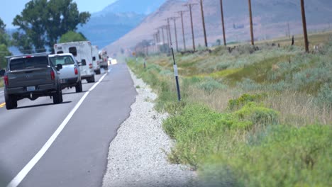 trucks-travel-down-long-open-road