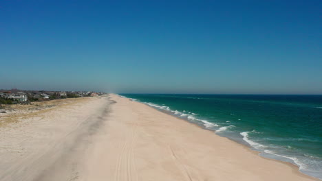 Epic-drone-shot-of-Hamptons'-Southhampton-Beach,-capturing-the-vast-sea-and-ocean-beauty,-offering-a-unique-perspective-from-New-York