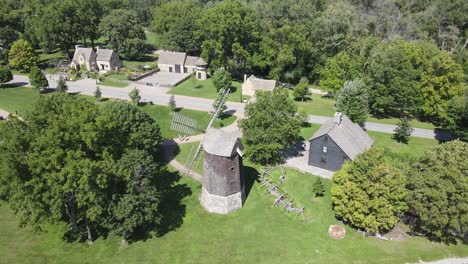 Greenfield-village-with-old-homes-and-millhouse,-aerial-view