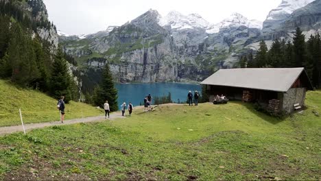 Switzerland,-Brienz,-February-10,-2024:-Tourist-hike-Brienz-Lake-grasslands,-mountains,-valleys-and-meadows-in-Switzerland