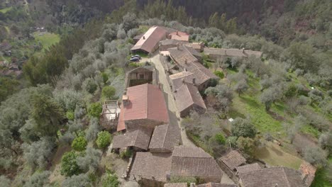 Aerial-orbit-over-the-Schist-village-Casal-de-São-Simão---a-unique-architectural-heritage-landscape-hidden-in-Central-Portugal-mountains