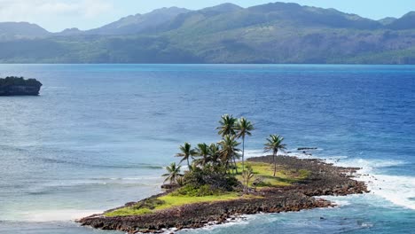 Telephoto-aerial-orbit-tiny-lonely-Caribbean-paradise-island-with-palm-trees