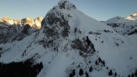 Fronalpstock-Switzerland-Glarus-Swiss-alps-pullback-aerial-reveals-sunny-background