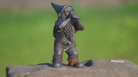 A-metal-statue-of-a-gnome-in-the-garden