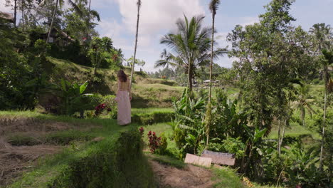 Tegalalang-Rice-Terrace-UNESCO-site-with-woman-in-dress-exploring-lush-scenery