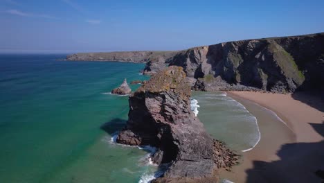Bedruthan-Steps-in-Cornwall-with-Rugged-Rock-Cliffs-and-Sandy-Beaches-from-an-Aerial-Drone-View