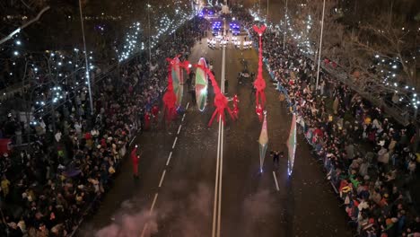 Parade-floats-greet-children-and-families-at-the-Three-Wise-Men-festival,-also-known-as-the-Three-Kings-Parade