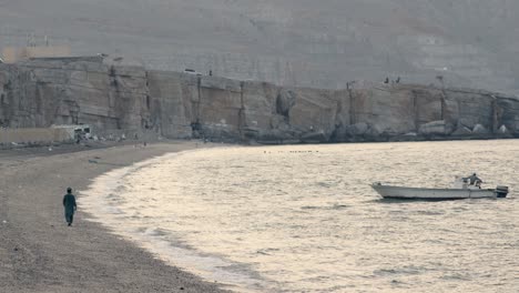 Traditional-Fisher-boats-docked-in-the-waters-of-Musandam,-a-tourist-destination-in-Oman