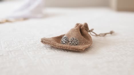 Elegant-Jewelry-in-Burlap-Pouch-on-Lace