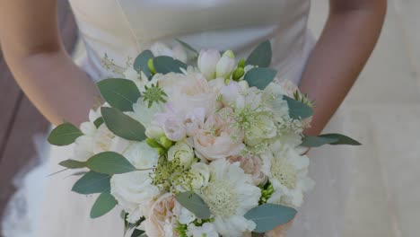 Bride-holding-Bridal-Bouquet-Elegance-in-Lyon,-France---close-up