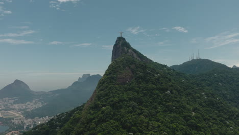 Panoramic-aerial-view-of-Christ-the-Redeemer-with-Tijuca-Forest,-Rio-De-Janeiro,-Brazil
