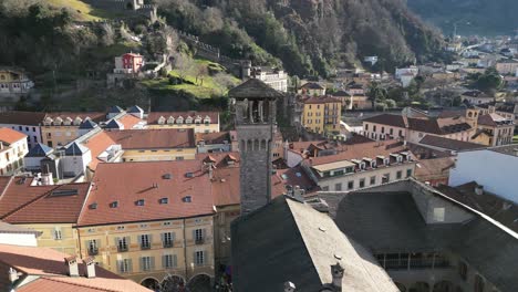 Bellinzona-Switzerland-church-bell-tower-rotating-aerial-view-on-sunny-day