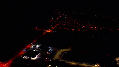 Elevated-Night-View-of-Suburban-Streets-and-Glowing-House-Lights