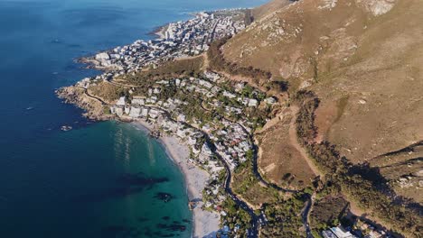 Aerial-drone-view-of-Clifton-Beach-in-Cape-Town,-South-Africa-with-beautiful-blue-and-aqua-water