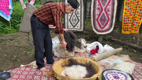 mix-black-white-woolen-fiber-black-white-sheep-wool-fabric-design-handmade-persian-namad-rug-carpet-in-Iran-traditional-skill-of-felt-beating-named-namad-mali-pattern-thickness-handicraft-material-mat