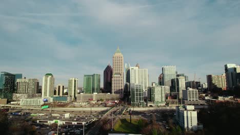 North-Atlanta,-Georgia,-USA,-showcasing-the-vibrant-city-skyline-adorned-with-towering-skyscrapers,-set-against-a-backdrop-of-highway
