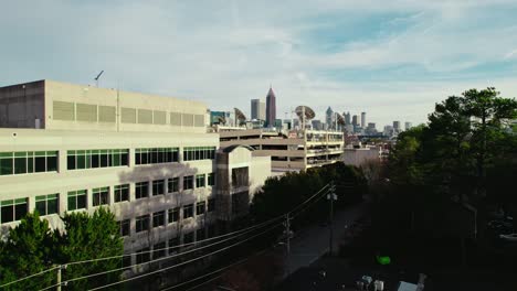 Rising-aerial-revealing-telecommunication-hub-in-north-Atlanta,-Georgia,-America