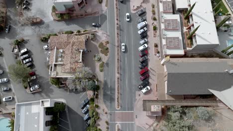 Sedona,-Arizona-downtown-traffic-with-drone-video-overhead-looking-down-then-tilting-up